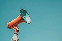 Megaphone holding person electronics.