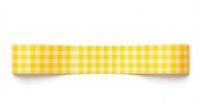 Gingham pattern adhesive strip yellow white background accessories.
