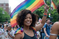 Photo of black woman rainbow parade street.