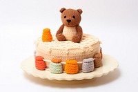 Knitted cute toy cake dessert food representation.