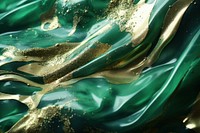 Polish liquid texture green gold silk.