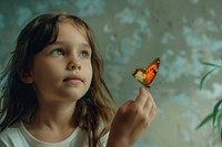 A young girl catching a single butterfly portrait animal child.
