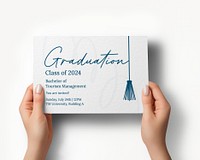 Hands holding graduation invitation card