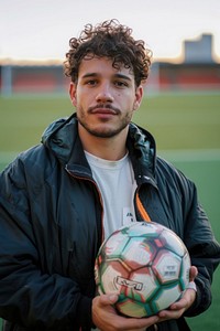 A man holding a soccer ball football sports adult.