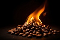 Coffee bean flame black fire black background.