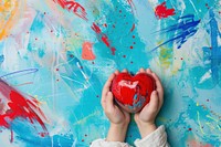Child hands holding red heart backgrounds drawing creativity.