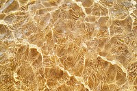 Water pattern on earth tone sand backgrounds outdoors texture.