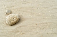 Zen rock on sand backgrounds outdoors pebble.