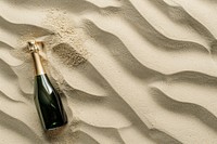 Champagne on sand outdoors bottle drink.