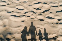 Family shadow on sand backgrounds outdoors nature.