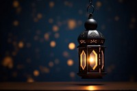 Ornamental Arabic lantern lighting glowing night.