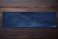 Dark blue adhesive strip rough paper wood.