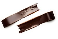 Dark brown shiny adhesive strip blade white background accessories.