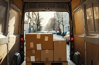 View from van of parcel delivery cardboard vehicle box.