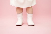 Infant in blank white booties footwear shoe sock.