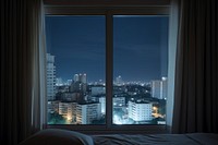 The scenery outside the window at night city architecture cityscape.