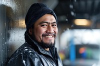 A smiling male hispanic worker in car wash portrait adult smile.