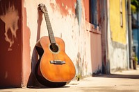 Acoustic guitar street music wall.