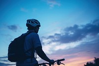 Cyclist silhouette photography bicycle vehicle helmet.
