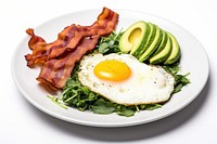 Keto friendly low carb breakfast plate with sunny side up eggs spinach bacon food.