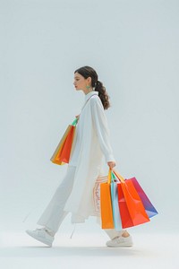 Woman Walking with Shopping Bags shopping bag handbag.