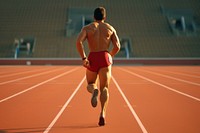 Rear view of an athlete starting his sprint on an all adult determination concentration.