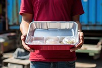 Plastic box container holding adult food.