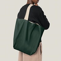 Man carrying green tote bag