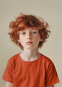 Red hair boy in dull orange t-shirt