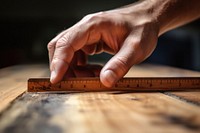 Tape measure measuring wood hand finger craftsperson.