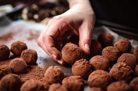 Hand making chocolate truffles food confiture freshness.