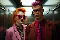A man and woman sunglasses portrait elevator.
