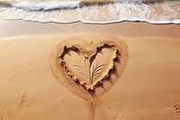 Simple drawing outdoors heart sand.