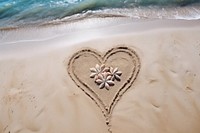 Simple drawing outdoors heart sand.