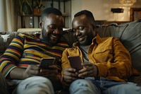 African American Gay couple phone electronics furniture.