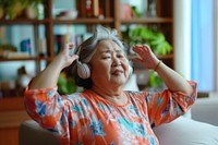 Woman in her 50s headphones photo electronics.