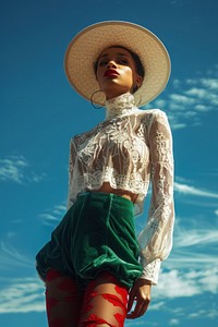 African American woman blouse hat beachwear.