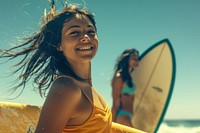 Hispanic woman carrying surfboard with her friend on the beach photo photography recreation.