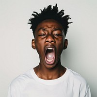 Black teenage boy yelling face shouting person.