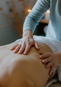 Woman massaging spa massage patient.