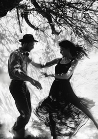 A woman dancing with a man recreation clothing apparel.