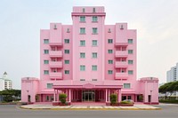 Pink pastel color minimal cube hotel in singapore architecture building plant.