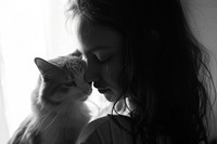 A girl cuddle a cat at home portrait mammal animal.