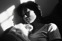 A girl cuddle a cat at home portrait mammal adult.