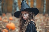 Girl dressed as a witch halloween portrait photo.
