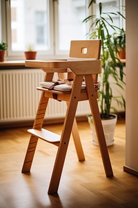 Kid maple wooden high chair furniture room architecture.