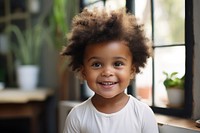 A happy african american toddler at home portrait child smile.