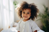 A happy multiracial toddler at home portrait child smile.