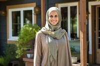 Woman in an abaya smile clothing apparel.