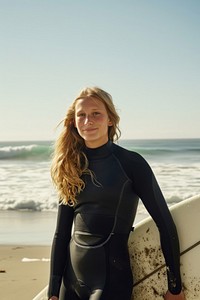 Female surfer with a surfboard at the beach outdoors portrait surfing.